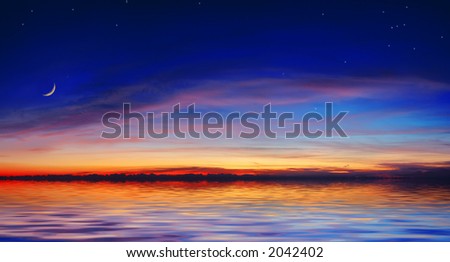The quiet sea on a background of a beautiful sunset with the moon and stars