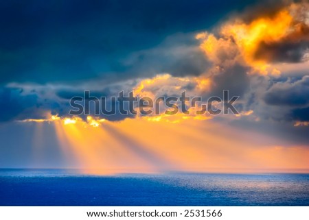 Through clouds on the sea light flows