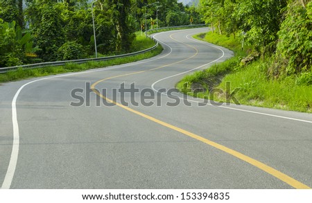Asphalt winding curve road in nature