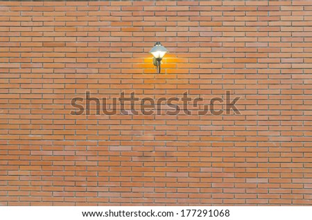red brick wall texture grunge background with vignetted corners of interior