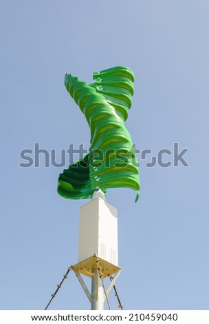 Wind turbine in the vertical spiral shape against blue sky background