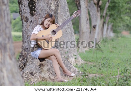 women chill out with guitar