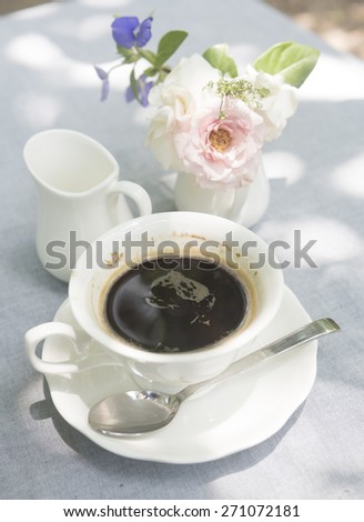black coffee with flower, natural light