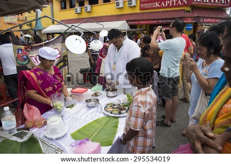 Georgetown, Penang, Malaysia - JULY 4 : Heritage Celebrations 2015 EAT RITE:Rituals Foods of George Town. Tourists attention to Celebrations on the opening day. on July 4,2015 in Penang, Malaysia.