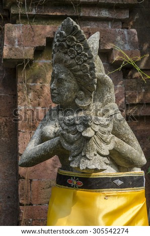 Statues of Hindu God or demons with offerings, Bali, Indonesia