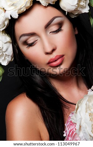 sexy brunette woman with flowers in hair