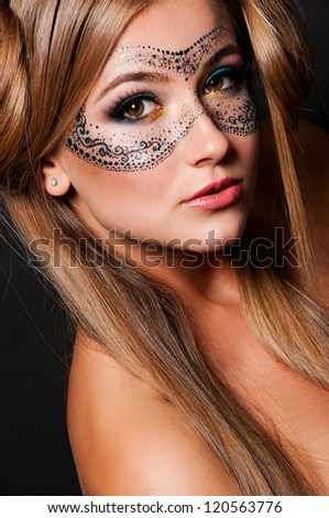 fashion portrait of sexy woman with mask on face
