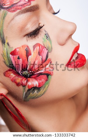 portrait woman with flowers on face face art