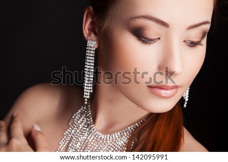portrait of young sexy woman with long earrings