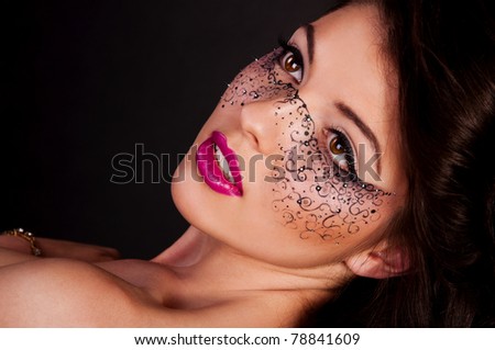 Pretty brunette woman with mask on face
