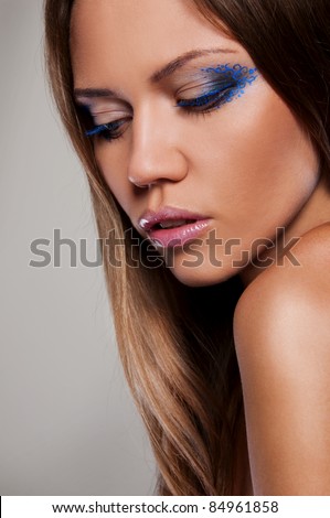 wonderful woman in blue dress and blue make up