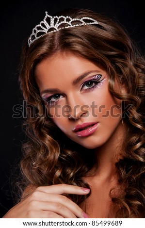 wonderful brunette woman with crown on the head