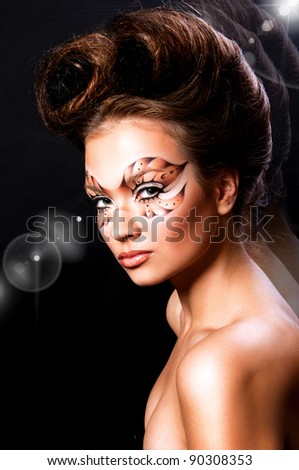 fashion photo of pretty woman with mask on face and creative hairstyle