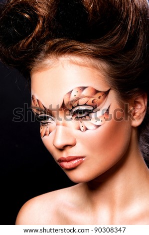 fashion photo of pretty woman with mask on face and creative hairstyle