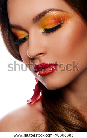 pretty woman with bright make up and orchid in the hair