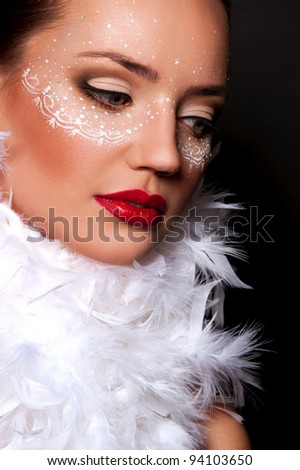 pretty brunette woman with sexy red lips with mask on face in pens on the neck