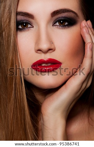 stock photo sexy woman with red chubby lips on black background