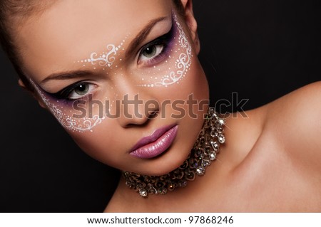 sexy woman with white mask on face, creative face art