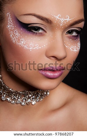 sexy woman with white mask on face, creative face art