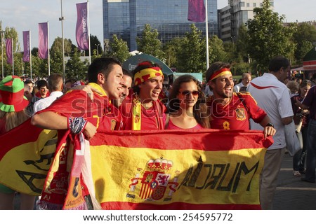 DONETSK, UKRAINE - JUNE 27, 2012: Spanish fans in Donetsk before the semi-final match of UEFA EURO 2012 Spain vs. Portugal. The joy of their continued and after games - Spain reached the final!