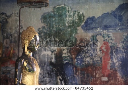 Buddha statue and old Murals.