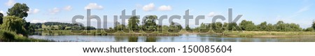 Panoramic image of River Dove at its confluence with the River Trent at Newton Solney, South Derbyshire, UK. The 45 mile river starts at Axe Edge Moor near Buxton and flows through the Peak District.