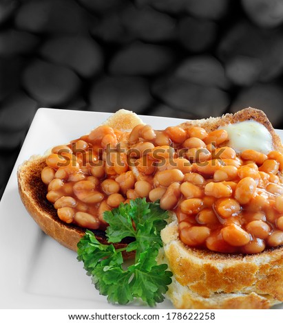 Baked beans on toast. A traditional English breakfast or snack. Image from my Pub Food Set. Copy space.