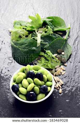 Super food salad. Edamame beans with blueberries and green leaf salad. Copy space.
