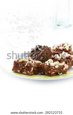 Delicious Rocky Road Belgium chocolate and marsh mellow chunks against white lace. Concept image for wedding favors or desserts. Copy space.