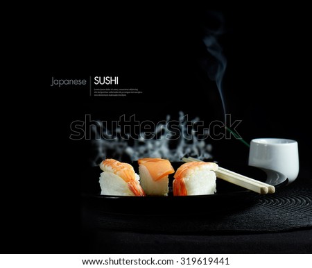 Creatively lit fresh Japanese sushi against a black background. The perfect image for for your asian menu cover design. Accommodation for copy space.