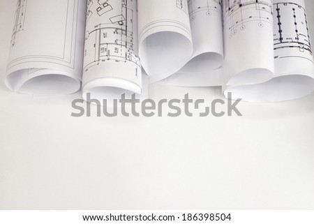Scrolls of architectural drawings The desk architect Scrolls of architectural drawings The desk architect