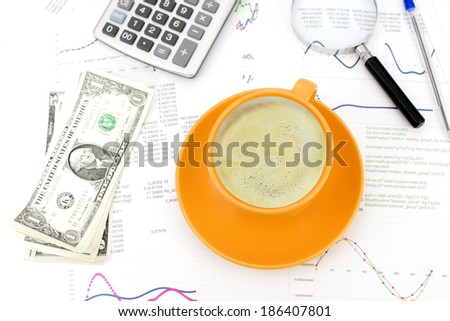 Cup of coffee, business objects and paper with graphs. Business concept