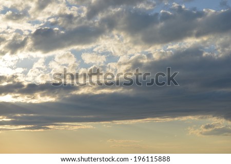 Evening blue sky. Clouds and sunset gold color