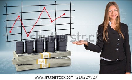 Businesswoman points hand on barrels oil and money