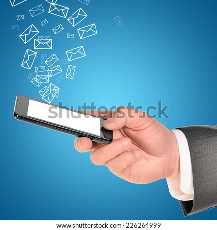 Man hands using smart phone with flying envelopes. Connection concept