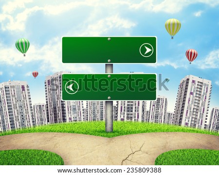 Blank route pointer of two green boards showing opposite directions, by footpath crossroad, against high-rise buildings of same design, a few air baloons above. Curved Earth