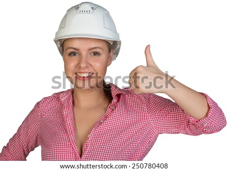 Woman in hard hat showing thumb-up, looking at camera, smiling. Isolated on white background
