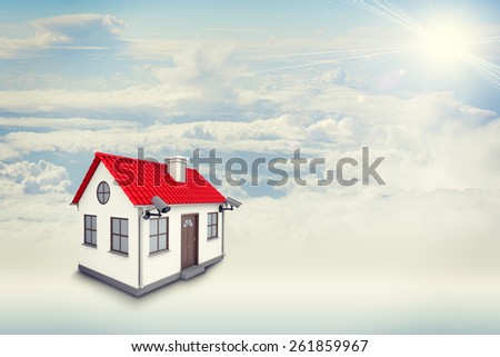 White house with red roof, brown door, chimney and outward chambers in clouds. Background sun shines brightly on large clouds