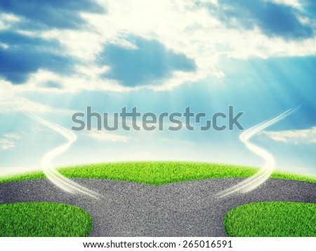 Road fork  and green grass field. Sky with clouds and sun beams in background