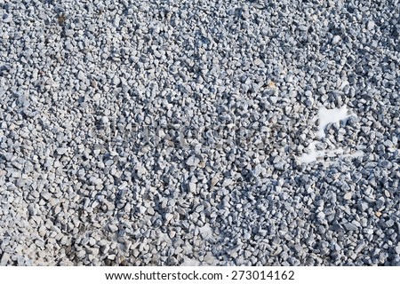 Abstract texture background with small stones. Surface with a large number of stones