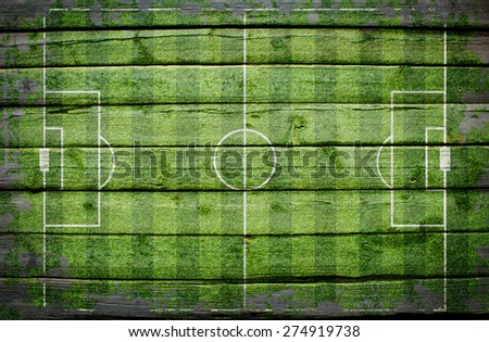 Football stadium with gates painted on wood plank, top view
