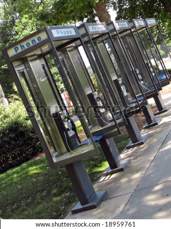 a row of identical pay phone booths