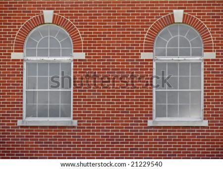 stock-photo-two-arched-windows-on-red-brick-building-21229540.jpg