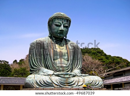 giant metal Buddha statue in springtime japan
