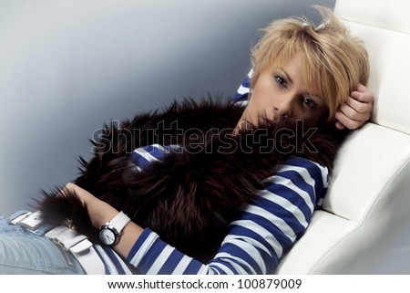 Beautiful lying woman lying on the sofa