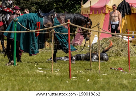 CHORZOW,POLAND, JUNE 9: Medieval knight defeated in jousting during a IV Convention of Christian Knighthood on June 9, 2013, in Chorzow