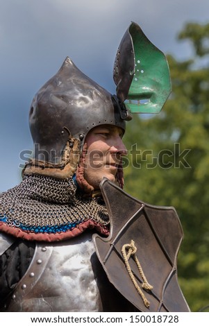 CHORZOW,POLAND, JUNE 9: Medieval Knight with raised visor during a IV Convention of Christian Knighthood on June 9, 2013, in Chorzow