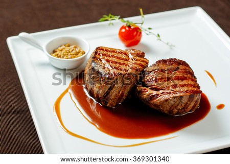 Filet mignon with red wine sauce, mustard and cherry