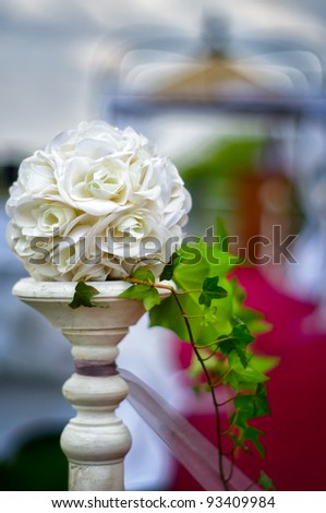 stock photo A floral wedding decoration at red carpet to gazebo