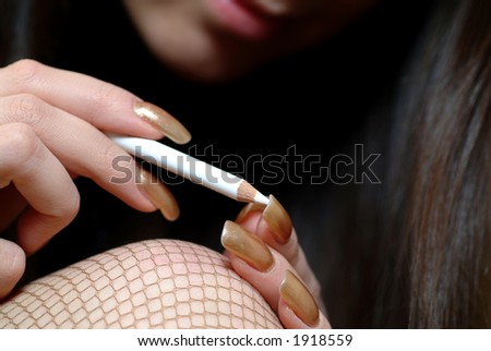Woman making up her nails